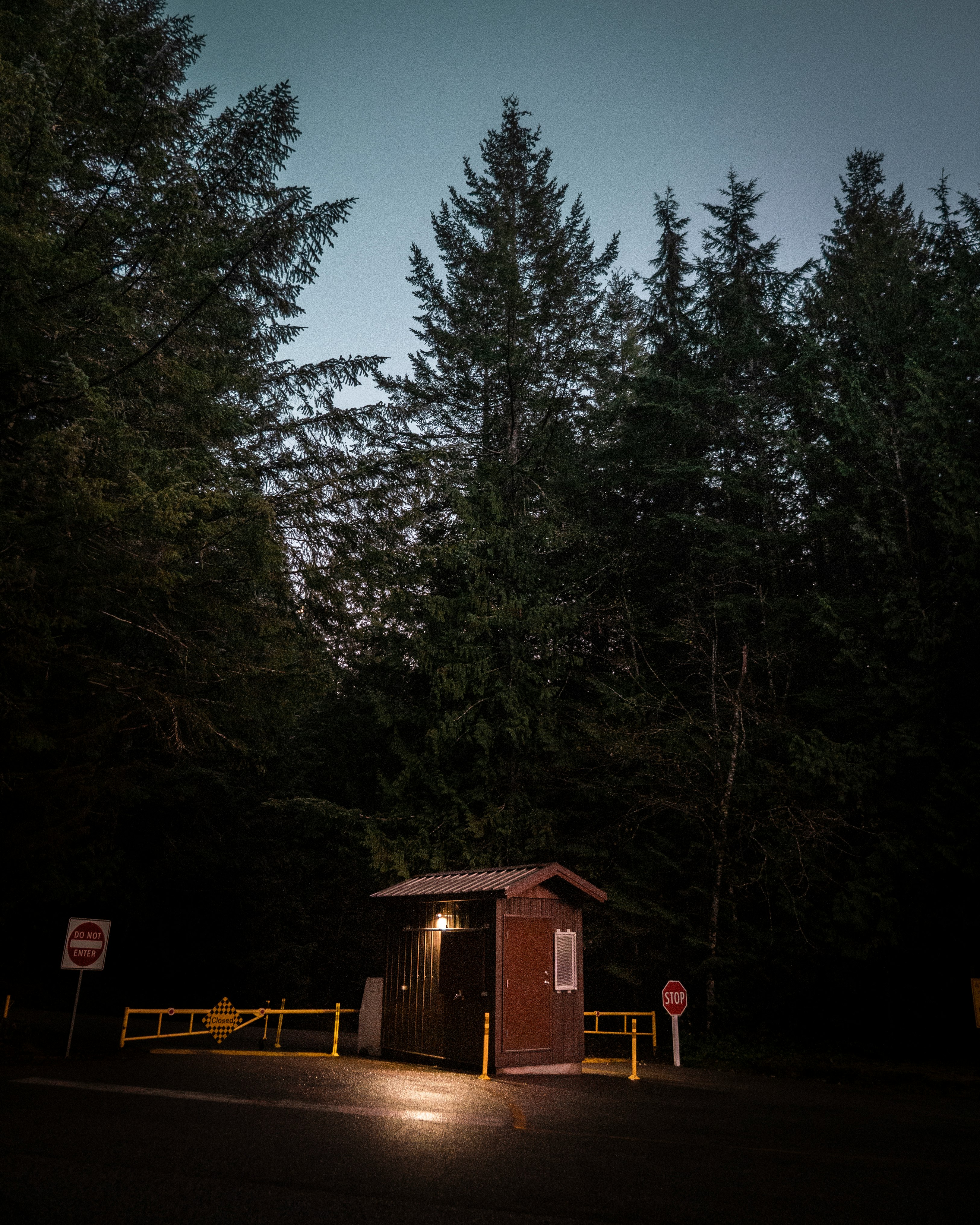 lighted brown wooden shed